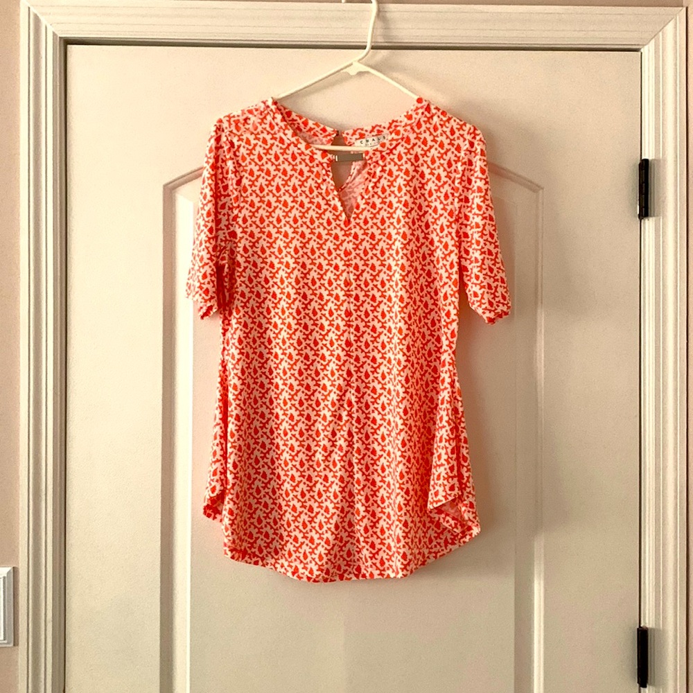 Pink and white shirt sleeved blouse